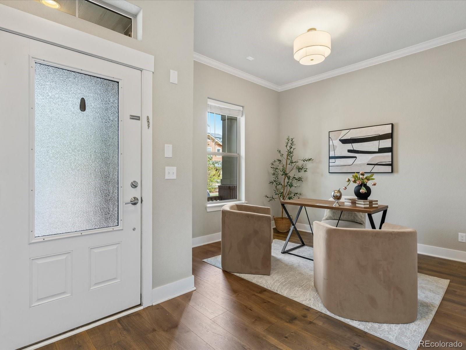 5468 Uinta Way Denver, CO 80238 - Photo 2 of 44 a living room with furniture and wooden floor