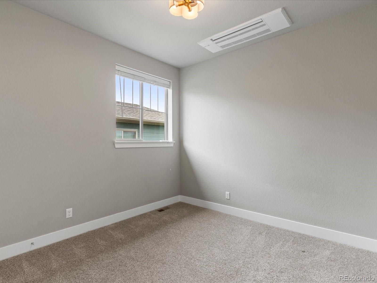 5468 Uinta Way Denver, CO 80238 - Photo 25 of 44 an empty room with a window
