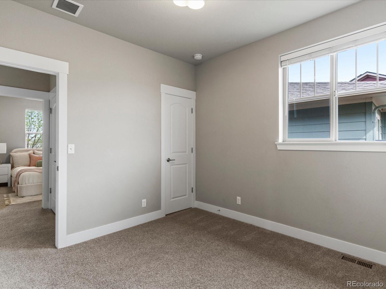 5468 Uinta Way Denver, CO 80238 - Photo 26 of 44 an empty room that has a window