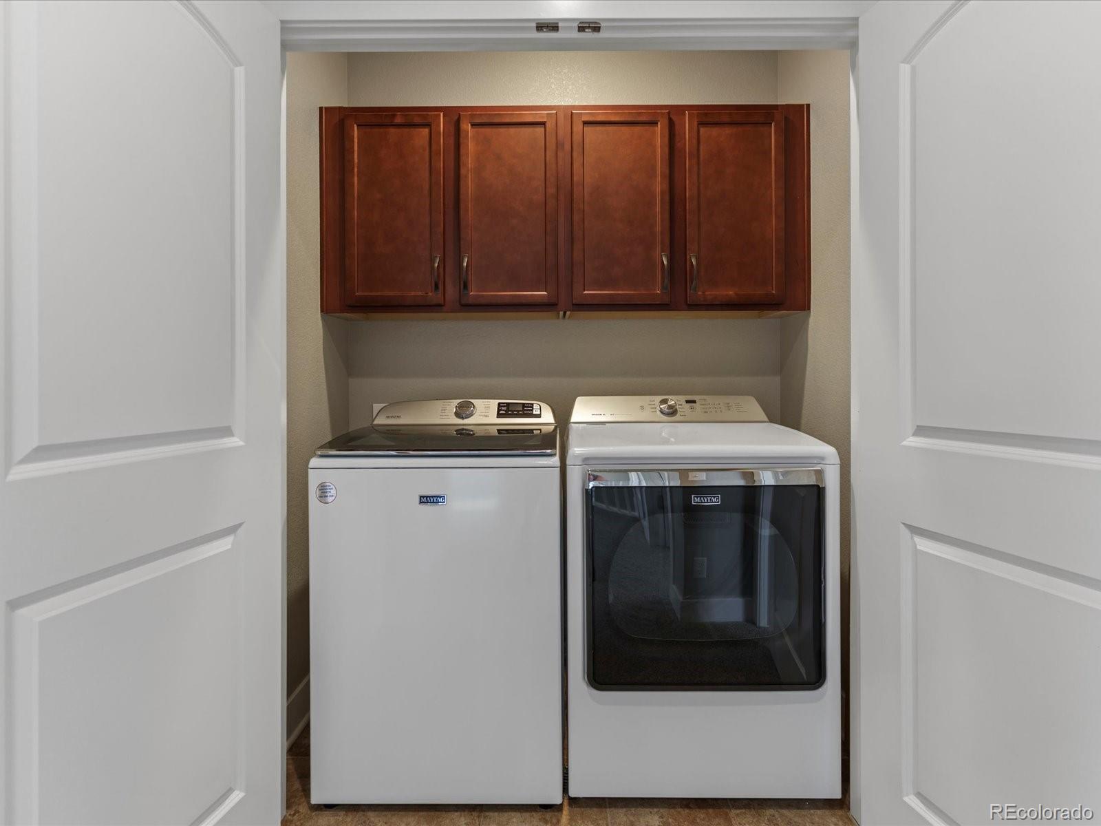 5468 Uinta Way Denver, CO 80238 - Photo 27 of 44 a kitchen with a stove and a microwave