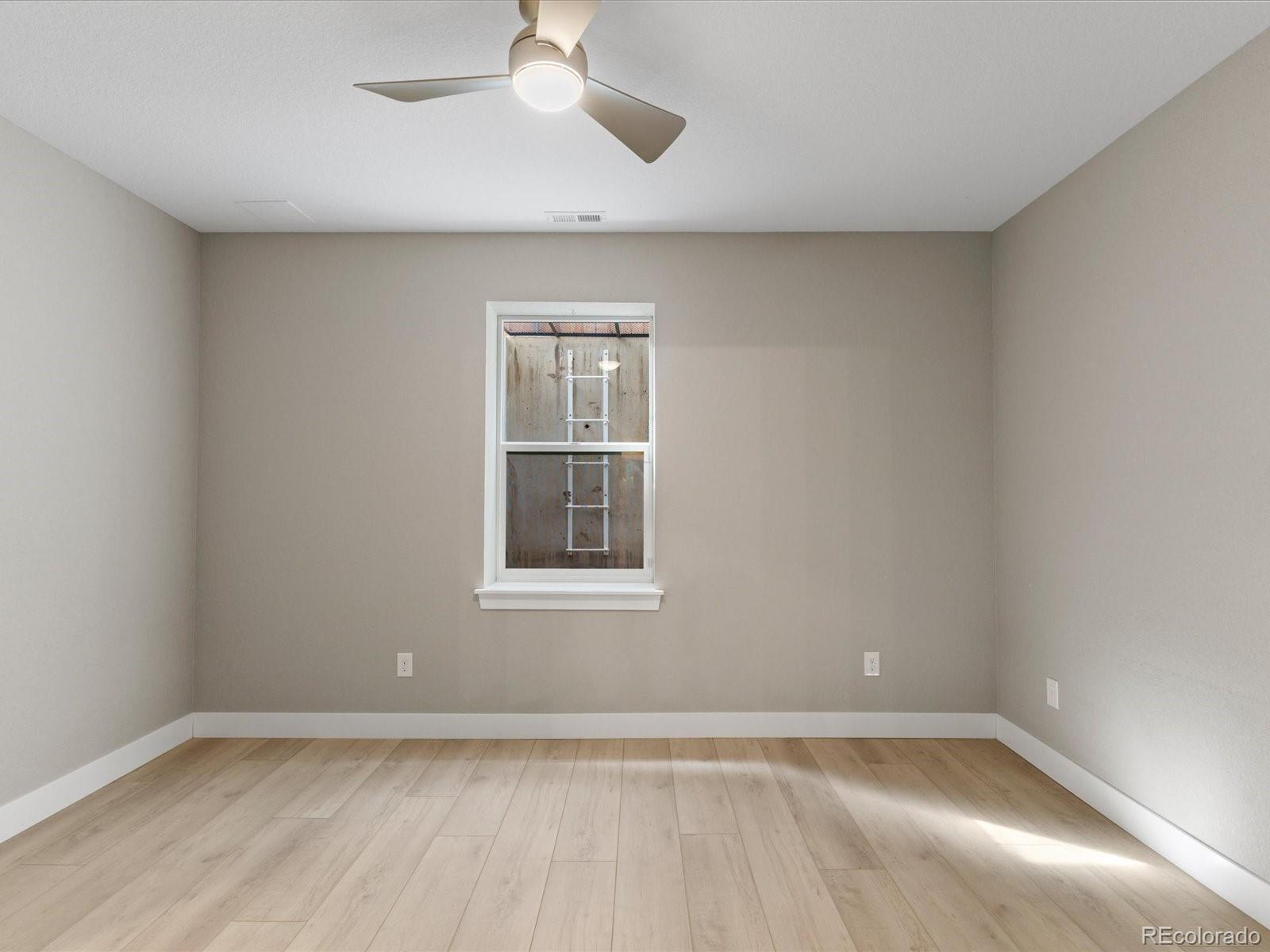 5468 Uinta Way Denver, CO 80238 - Photo 31 of 44 an empty room with a empty space and windows