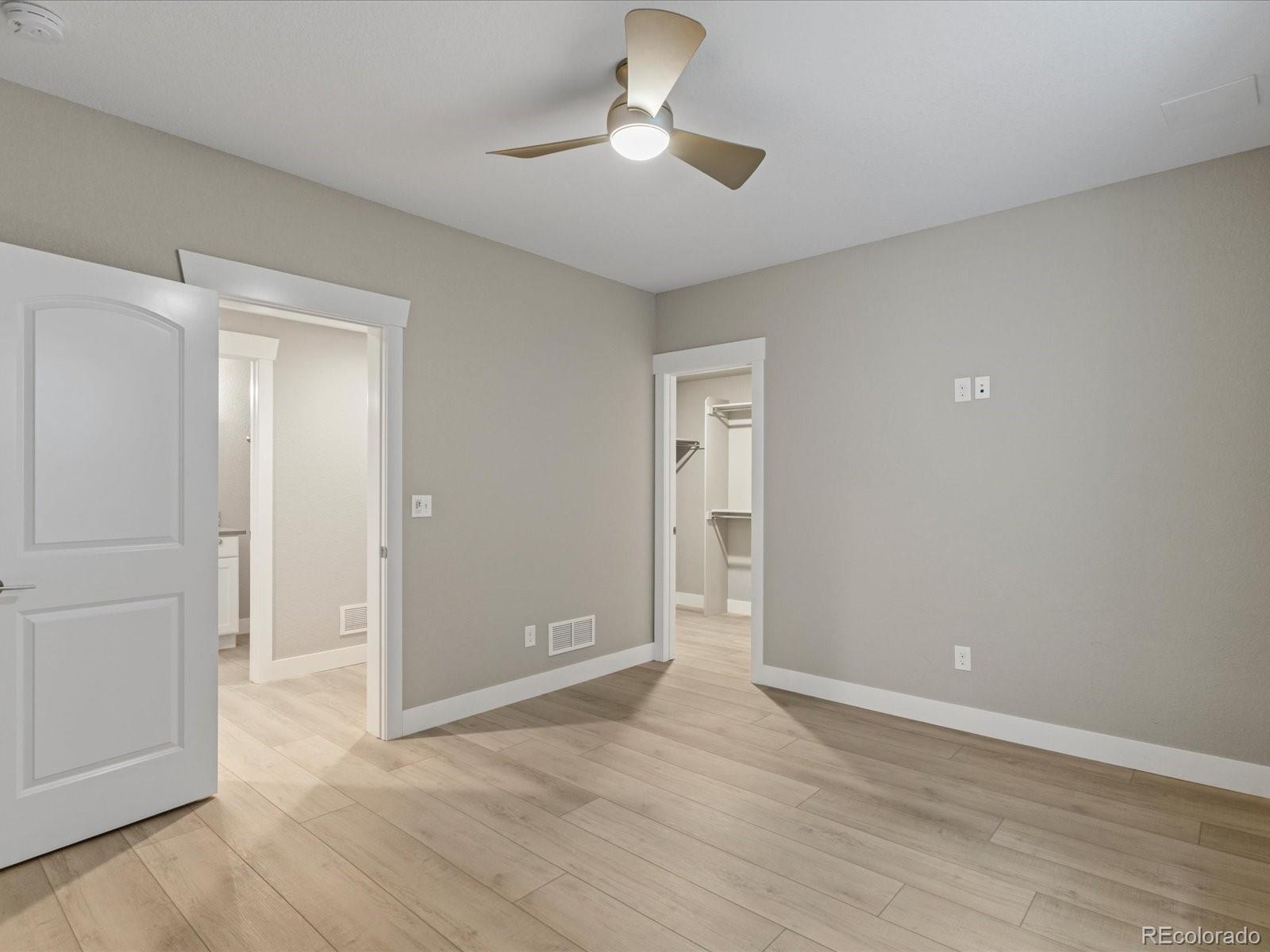 5468 Uinta Way Denver, CO 80238 - Photo 32 of 44 wooden floor in an empty room with a window