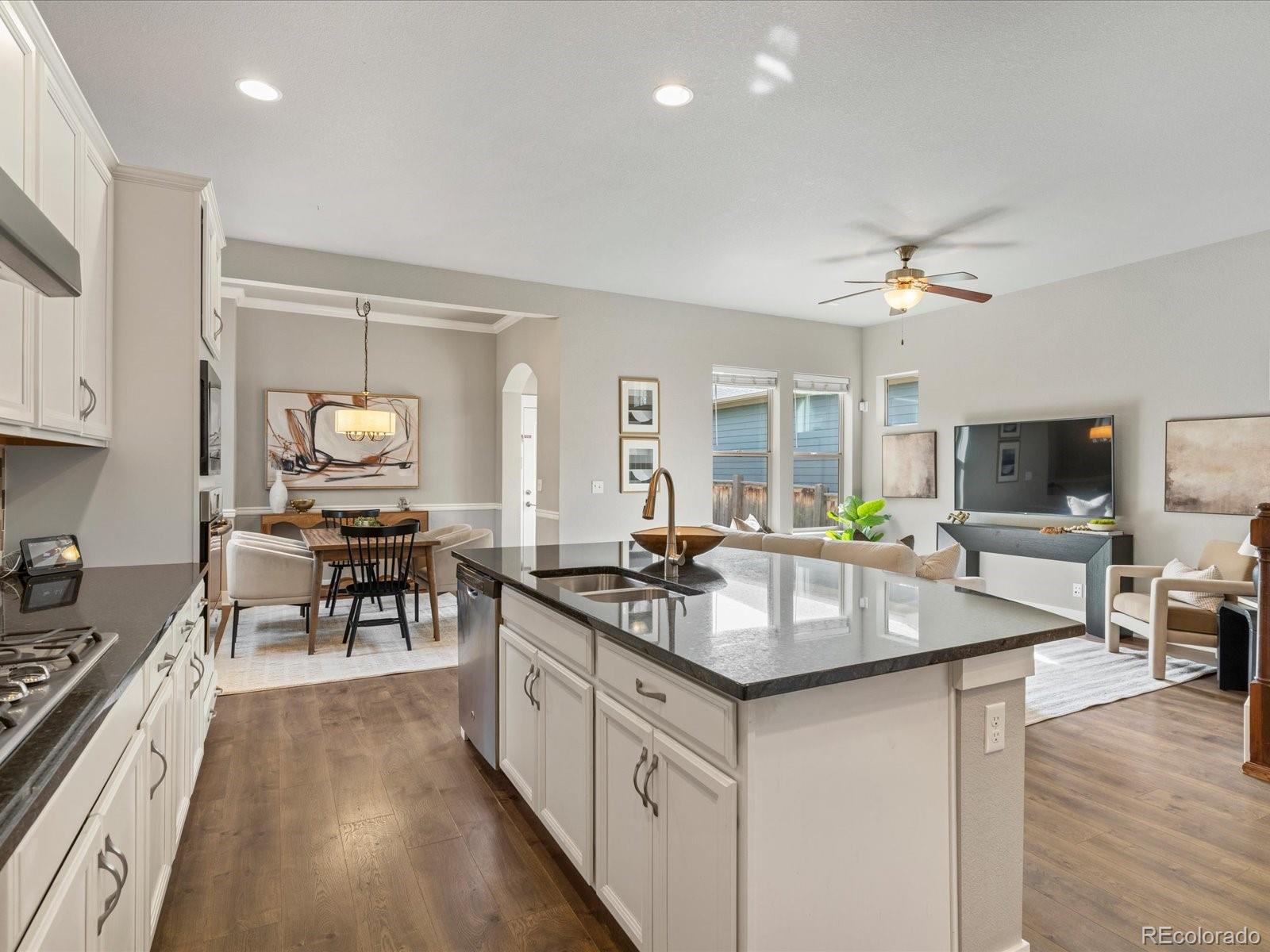 5468 Uinta Way Denver, CO 80238 - Photo 7 of 44 a kitchen with counter space cabinets and appliances