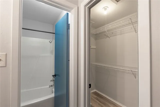 a bathroom with a glass shower door