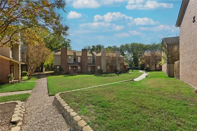a view of a playground with basketball court