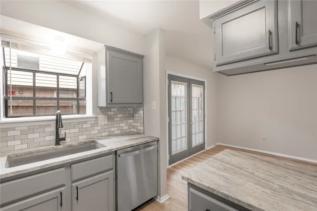 a kitchen with a sink and cabinets