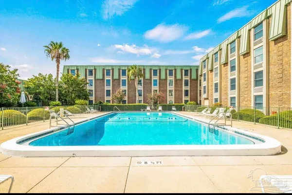 a view of swimming pool with outdoor seating