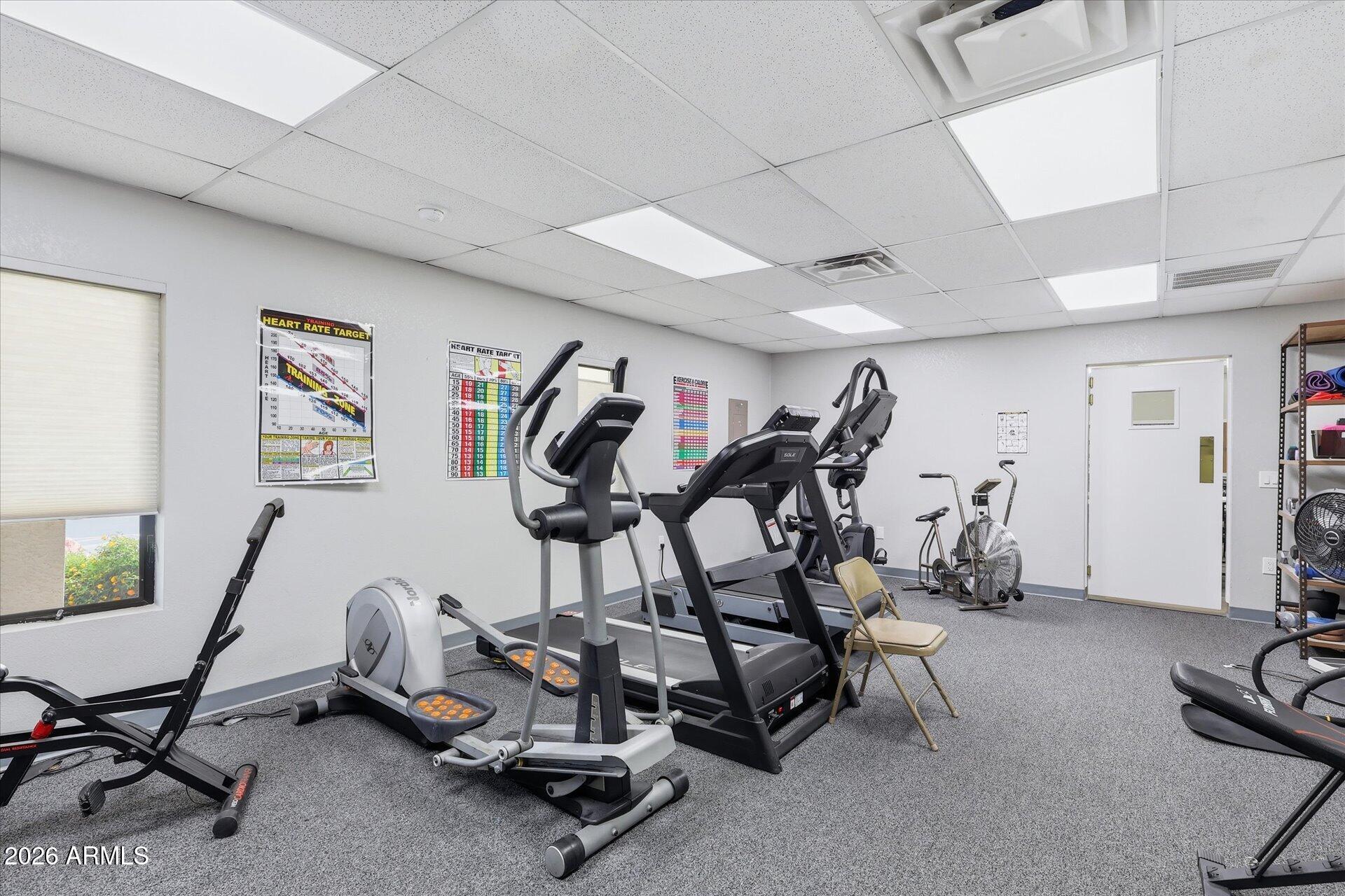 3270 South Goldfield Road, Unit 716 Apache Junction, AZ 85119 - Photo 30 of 36 a view of a room with gym equipment