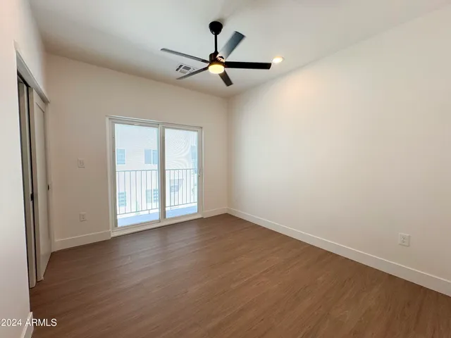 a bathroom with a granite countertop sink toilet a large mirror a vanity and shower