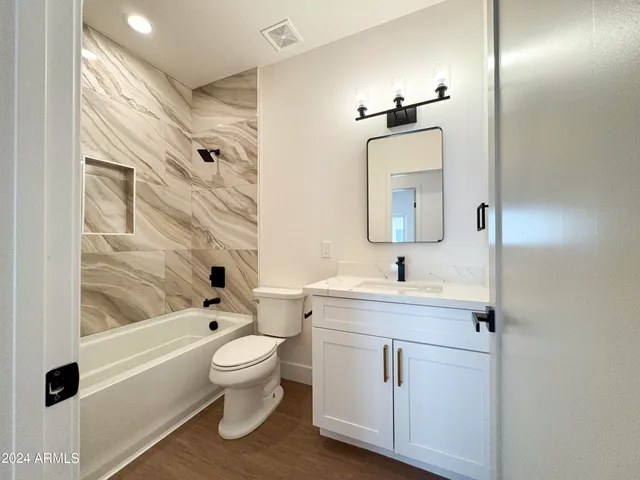 a bedroom with bed and balcony