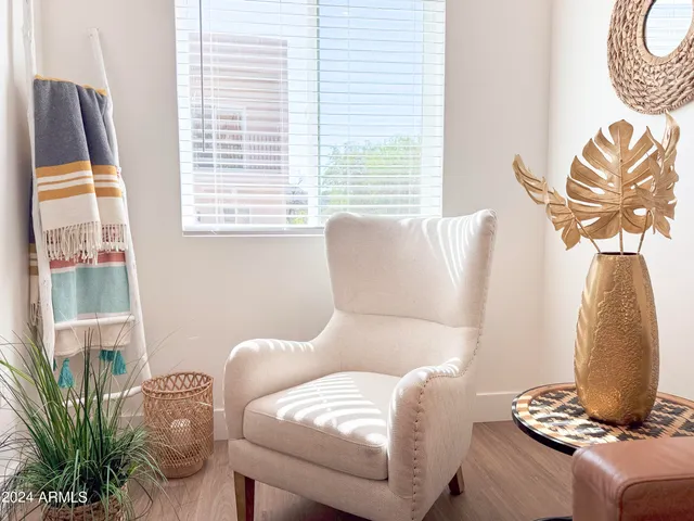 a kitchen with stainless steel appliances kitchen island granite countertop a refrigerator sink and white cabinets