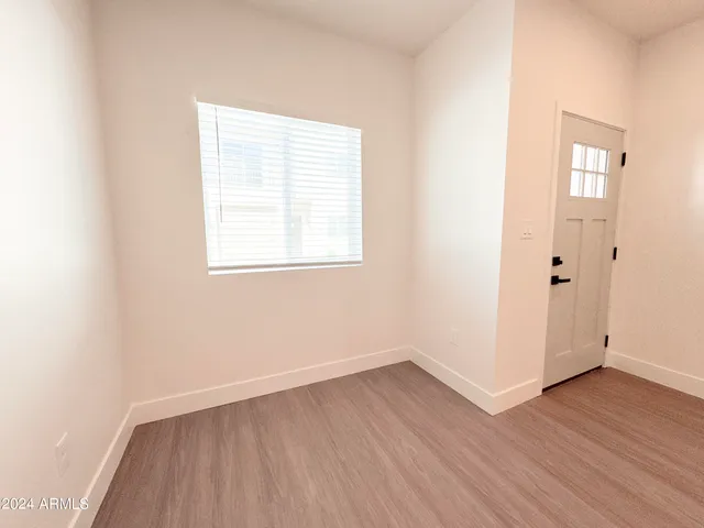 a view of a kitchen with wooden floor