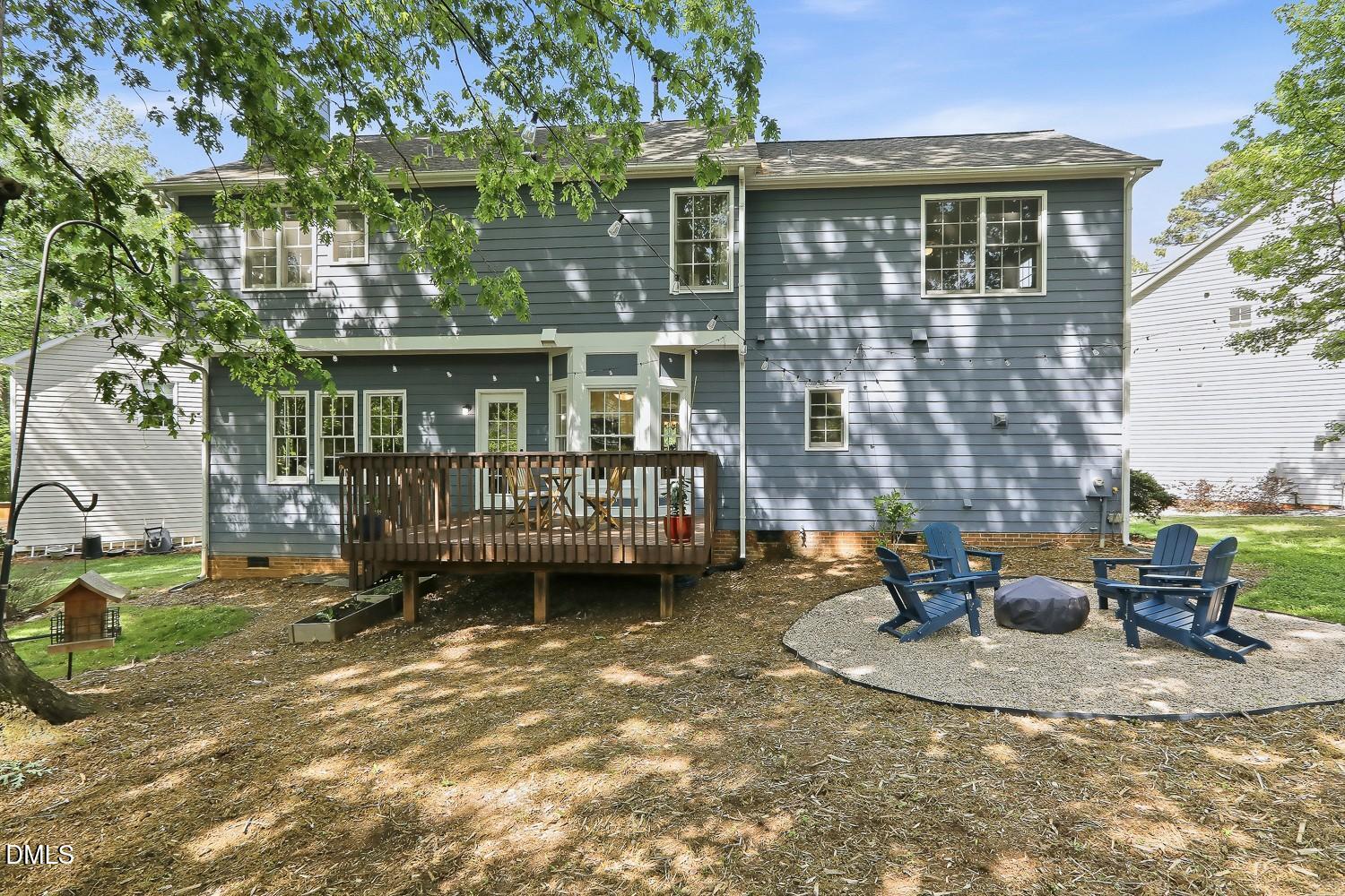 4001 Batiste Road Raleigh, NC 27613 - Photo 51 of 63 a view of a house with a yard and sitting area