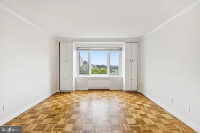 a view of an empty room with a window