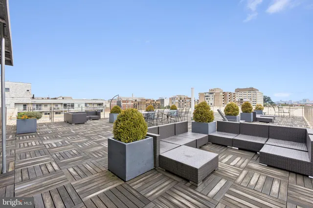 an outdoor living room with furniture