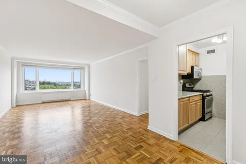 a view of a kitchen with a sink and a stove top oven