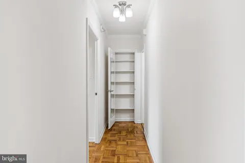 a view of a hallway with a closet