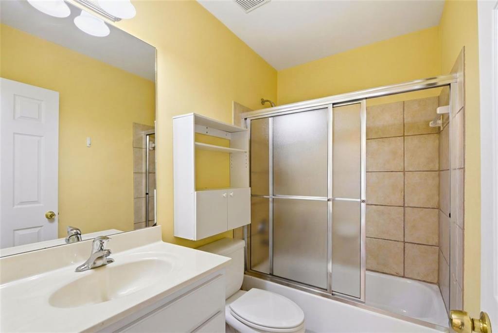 3420 Bulloch Lake Road Loganville, GA 30052 - Photo 46 of 57 a bathroom with a sink toilet and shower