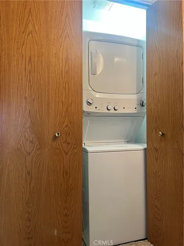 a bedroom with a bed and flat screen tv