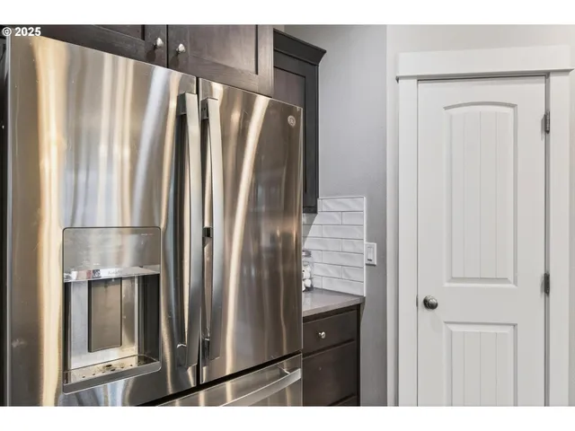 a bathroom with a shower and a mirror