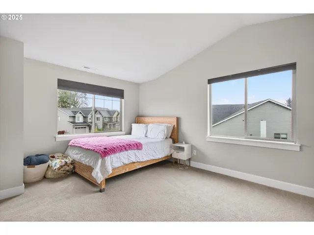 a bedroom with a bed and window