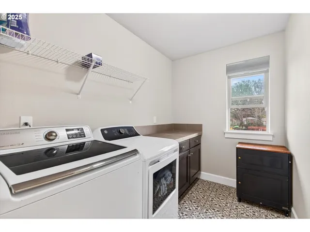 a utility room with washer and dryer