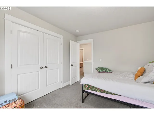 a hallway with a table and couch