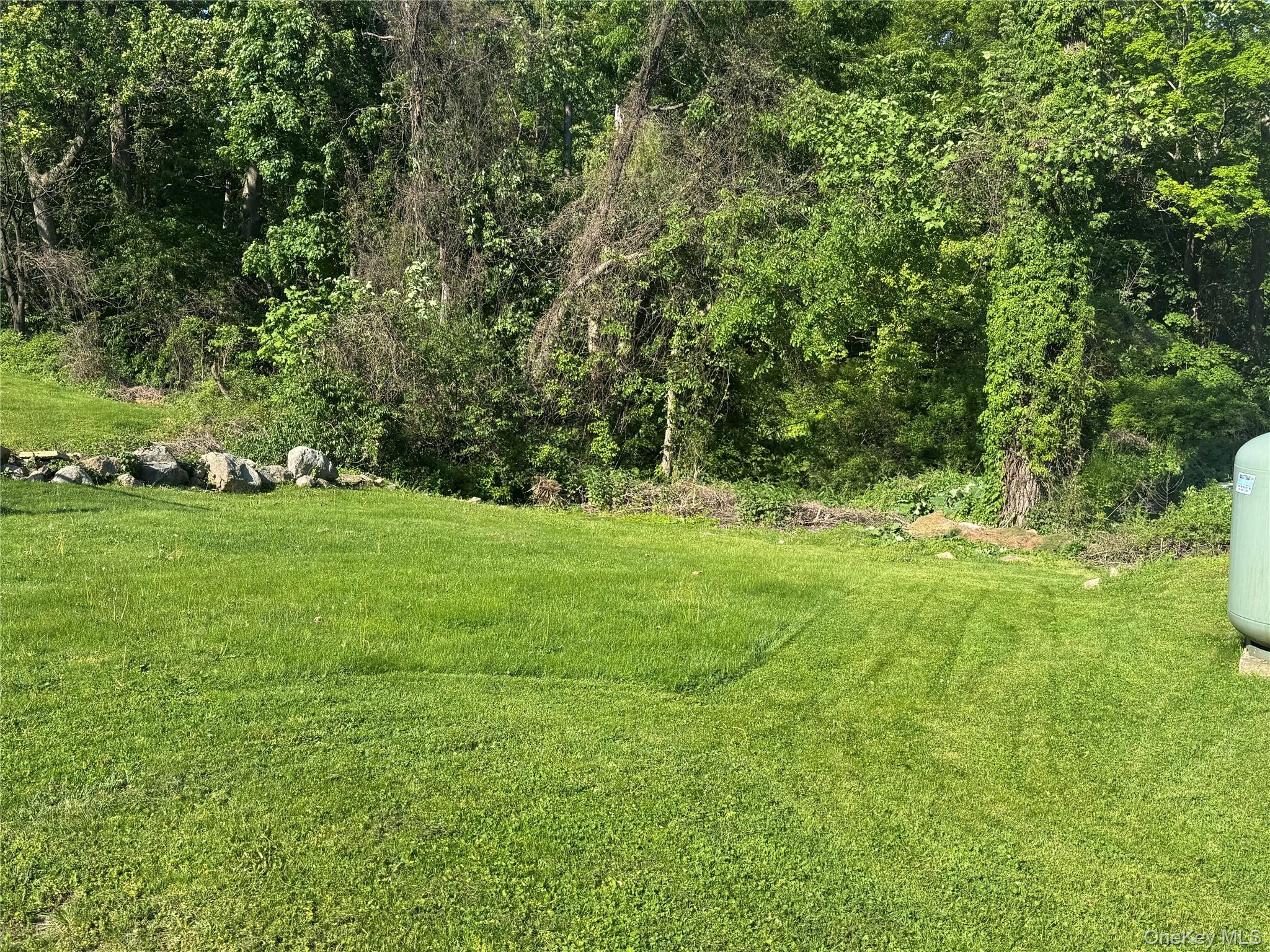 62 Whippoorwill Road East, Unit A Armonk, NY 10504 - Photo 2 of 15 Enjoy privacy of your backyard.