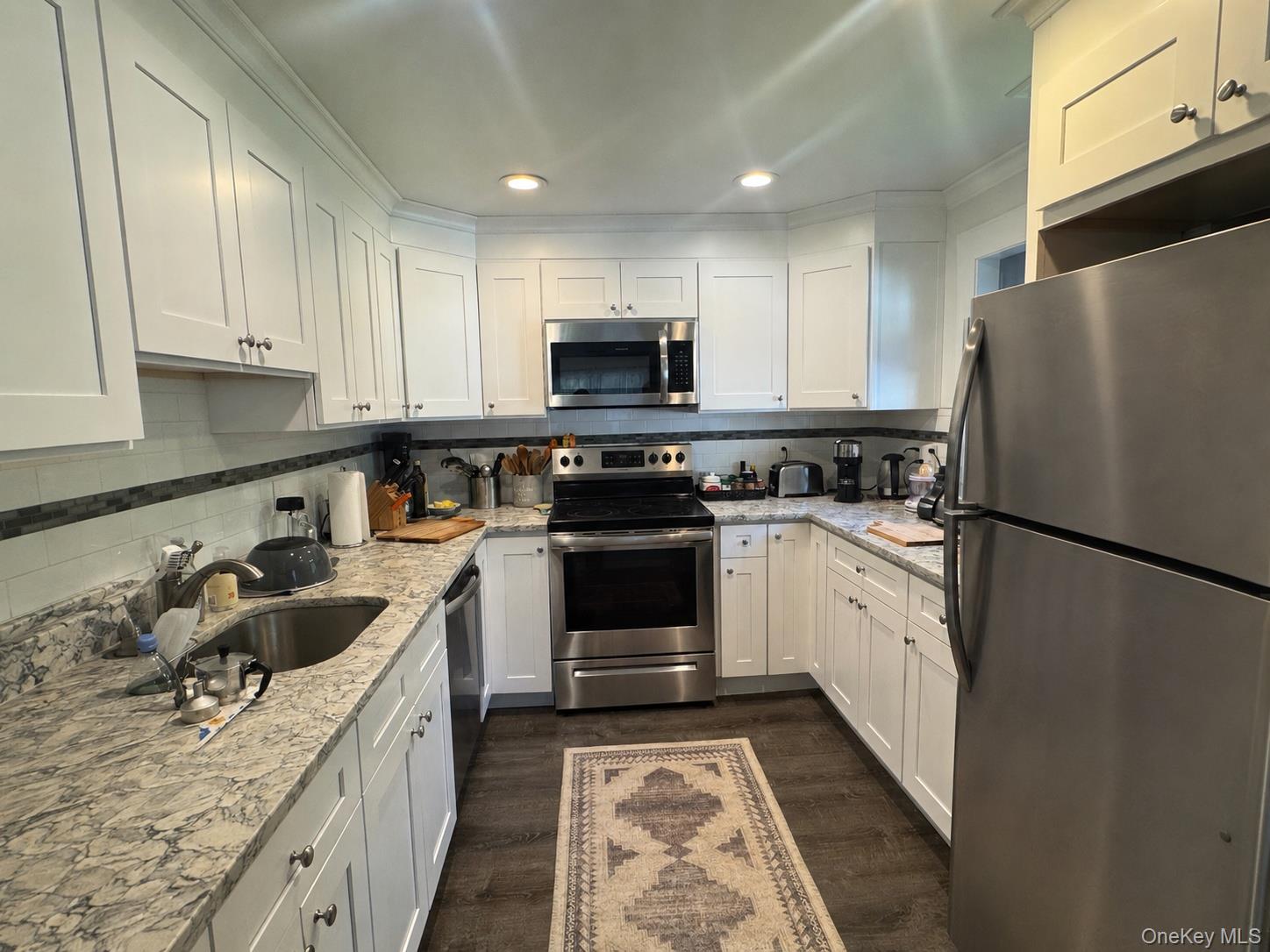 62 Whippoorwill Road East, Unit A Armonk, NY 10504 - Photo 6 of 15 Gorgeous cabinetry and granite countertop with top of the line stainless steel appliances.
