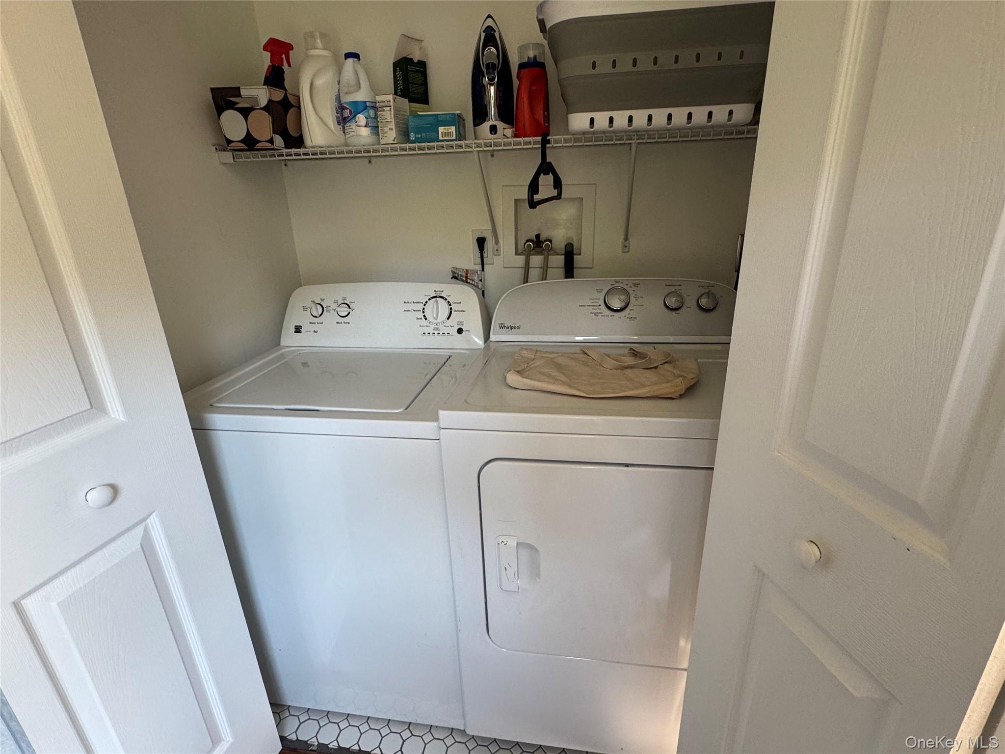 62 Whippoorwill Road East, Unit A Armonk, NY 10504 - Photo 8 of 15 Laundry closet with shelving