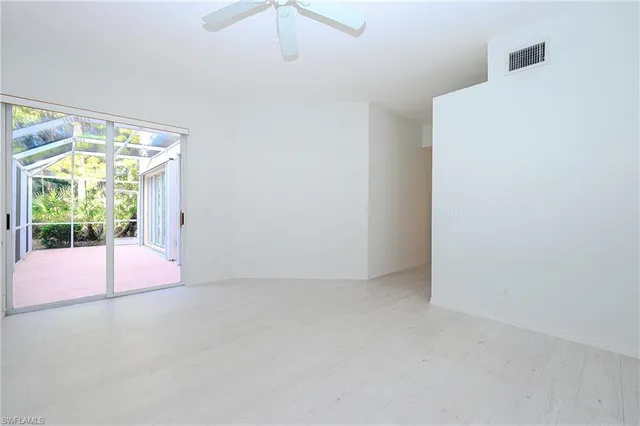 a view of empty room with floor to ceiling window