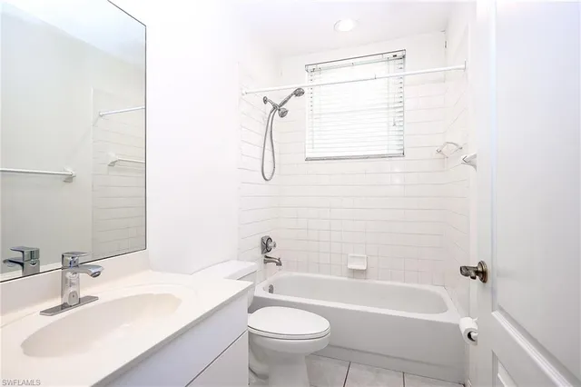 a bathroom with a sink a toilet and a bathtub