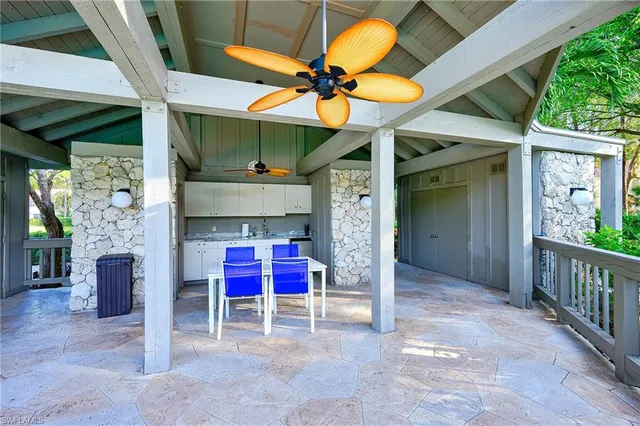 a view of a balcony with a table and chairs