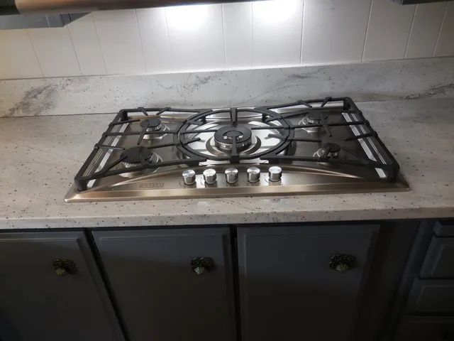 a kitchen with a sink and window