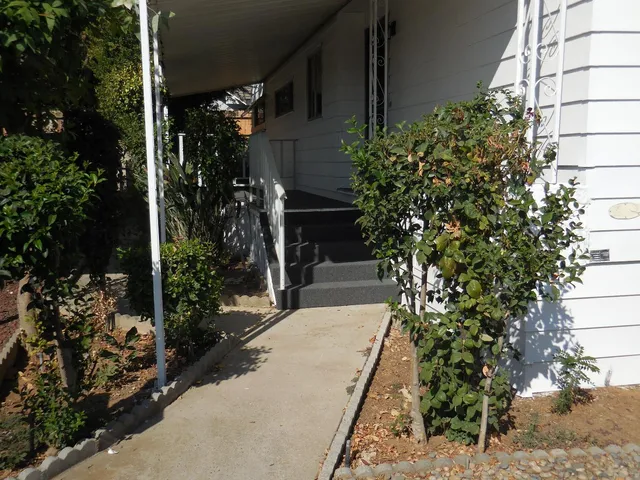 a view of house with flower garden