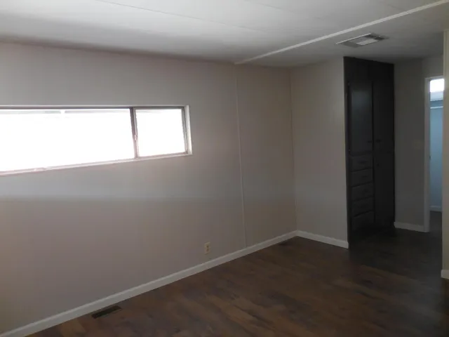 a view of front door with wooden floor