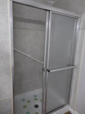 a bathroom with a sink double vanity and a mirror