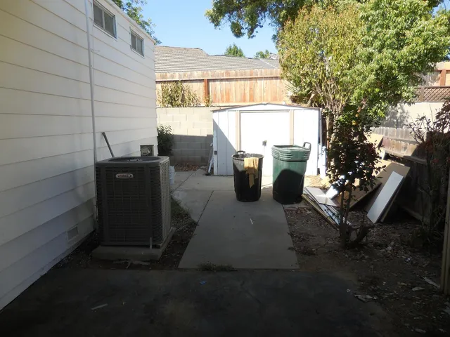 a view of a pathway with a backyard