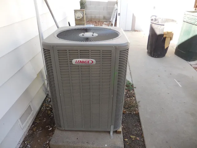 a kitchen with granite countertop a sink cabinets and stainless steel appliances