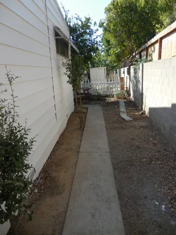 a modern kitchen with stainless steel appliances granite countertop a stove a sink and a refrigerator