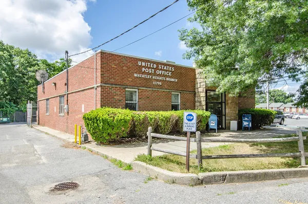 a front view of a building with garden