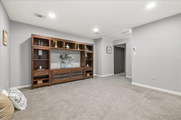 a view of an empty room and workspace