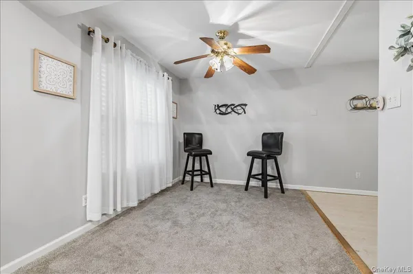 an empty room with closet and wooden floor