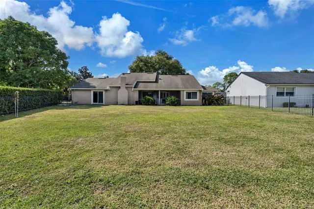 an aerial view of a house with a swimming pool yard and outdoor seating