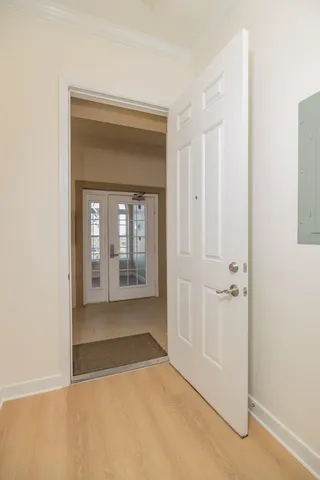 a kitchen with granite countertop white cabinets and stainless steel appliances