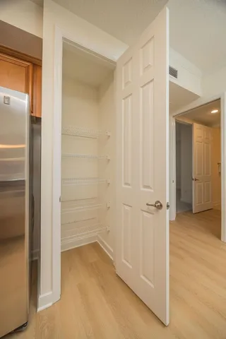a kitchen with sink a window and cabinets