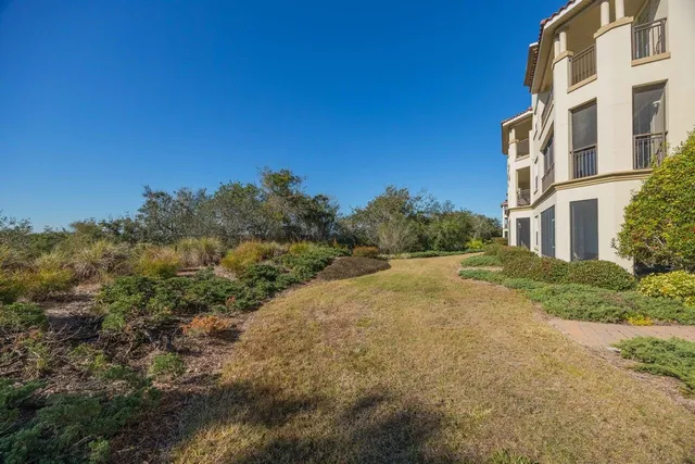 a view of a road with a building in the background