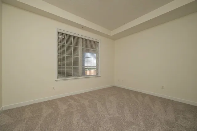 a view of a house with swimming pool and sitting area