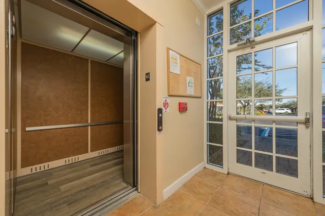 an empty room with a mirror and a mirror