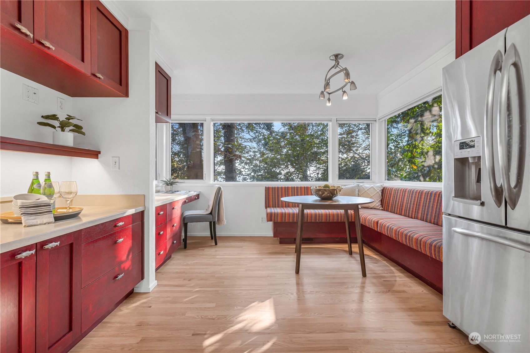 436 36th Avenue Seattle, WA 98122 - Photo 13 of 39 a living room with furniture a large window and wooden floor